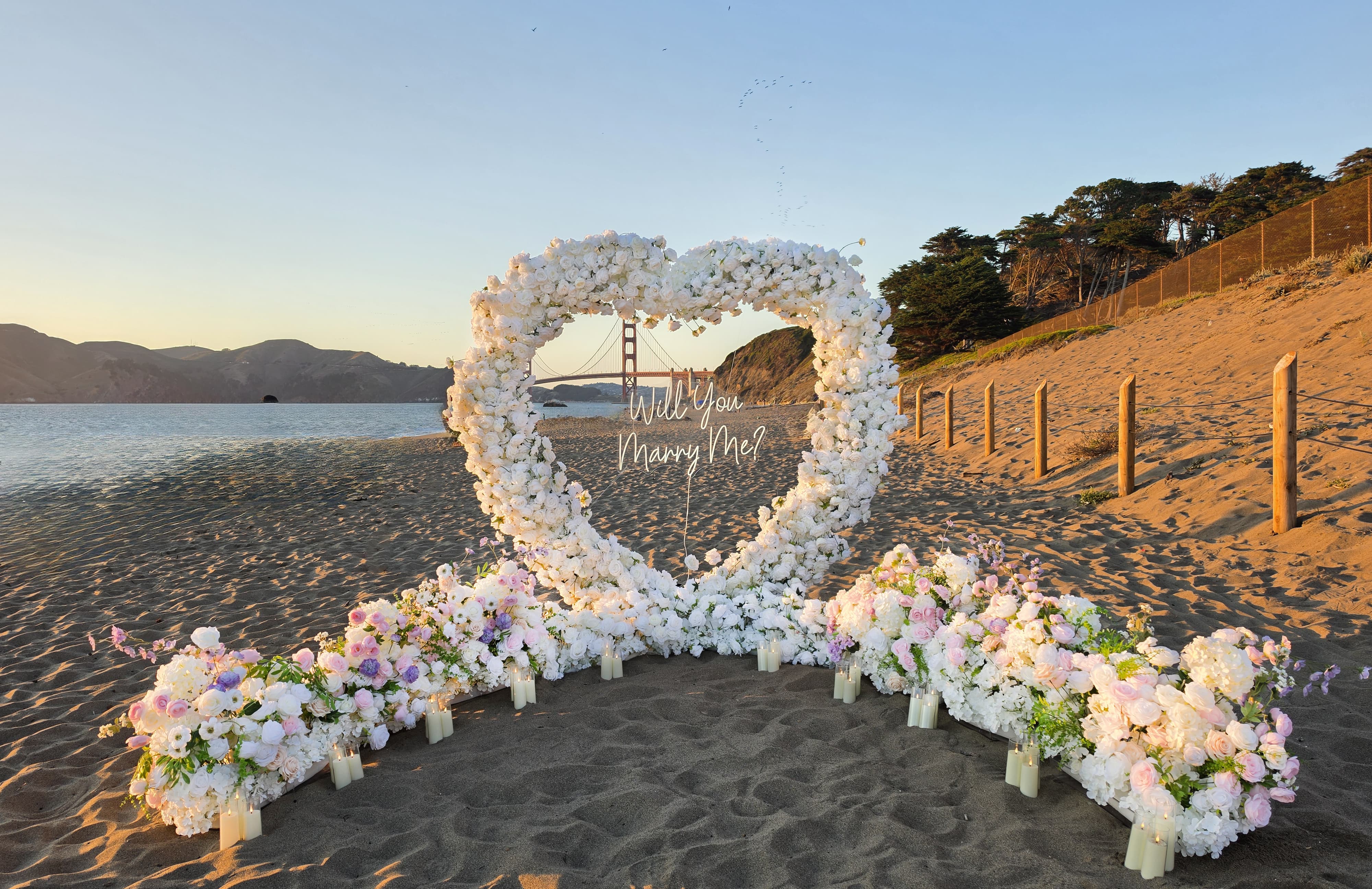 The Blooming Heart floral arch proposal setup at Baker Beach
