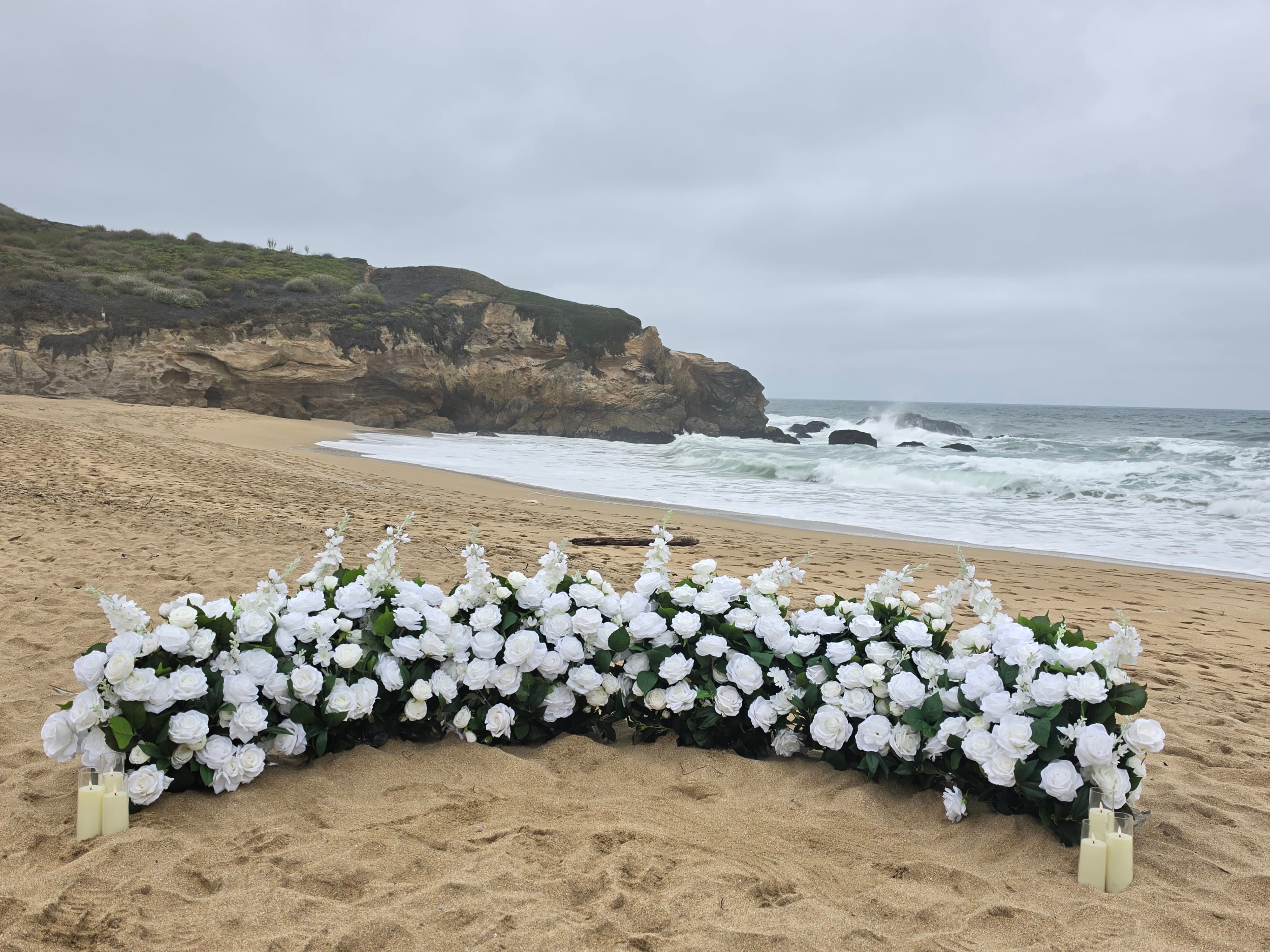 The Intimate Promise – white grounded florals with candles at Montara State Beach